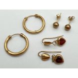 3 pairs of 9ct gold and filled gold earrings in varying conditions. To include a pair of heart