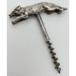 A vintage novelty corkscrew with silver handle modelled as a running fox, with red stone set eyes.