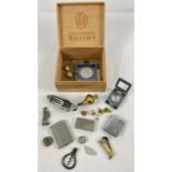 A vintage cigar box of assorted misc items. To include: cigar cutter; lead figure; folding book