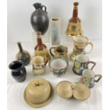 A box of assorted vintage ceramics to include studio pottery, large Wade Bells whisky decanters,
