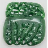 A carved piece of jade in the form of a bunch of radishes. Carved detail to both sides. Approx. 7.