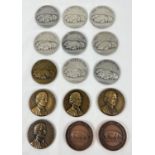 A collection of 15 gold, silver and bronze award medallions for pig breeding from the 1940's and