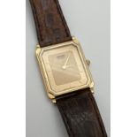 A vintage square shaped Seiko (9020-5730) gold tone cased watch with original brown leather strap.
