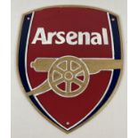 A painted cast metal shield shaped wall plaque for Arsenal Football club. With holes for fixing.