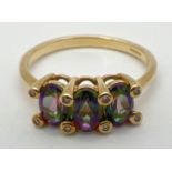 A 9ct yellow gold, mystic topaz and diamond trilogy ring. 3 oval cut mystic topaz stones (each