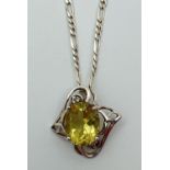 A silver and citrine pendant with decorative pierced work mount (approx. 2.25cm long). On an 18" 925