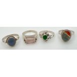 4 silver natural stone set dress rings, in varying styles and sizes. To include rose quartz and moss