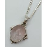 A rose quartz pendant in a silver mount, on an 18" silver 2mm figaro curb chain with lobster claw