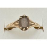 A vintage 9ct gold dress ring set with central oval cut smoked quartz. With claw setting and