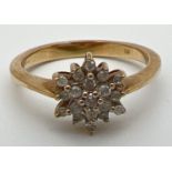 A 9ct gold and diamond cluster dress ring, set with 19 small diamonds. Fully hallmarked inside