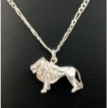 A silver pendant modelled as a lion, on an 18" figaro chain with lobster claw clasp. Lion measures
