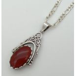 A silver rotating fob pendant set with onyx and carnelian on an 18" silver 2mm figaro curb chain.