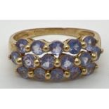 A 9ct yellow gold dress ring set with 3 rows of tanzanite stones. Stamped 9k and 375 inside band.
