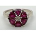 A Genuine Gem Company silver and pink tourmaline dress ring with a circular shaped mount. 6 trillion
