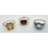 3 silver solitaire stone set dress rings, all stamped inside bands. To include garnet and citrine.