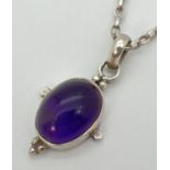 An amethyst pendant with 925 silver mount, on an 18" silver belcher chain with spring ring clasp.