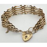 A 9ct gold 5 bar gate bracelet with heart shaped padlock clasp and safety chain. Fully hallmarked to