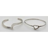 2 modern design silver bracelets. A wave design cuff bangle together with a open heart bangle with