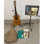 A Hijos De Vicente Tatay classic wooden cased guitar with carry case. Together with a guitar