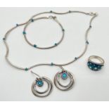 4 pieces of silver Jewellery. A necklace and matching bracelet made from long silver beads and