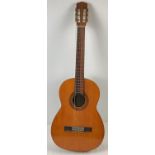 A vintage 1970's Suzuki No. 3066 wooden cased classic guitar by Suzuki Violin Co. Ltd. Strings
