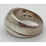 A modern contemporary design dome style silver dress ring. Hallmarked for Edinburgh 1998.