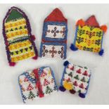 5 Central Asian heavily beaded wrap pouches, in varying colours, sizes and designs.