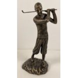 A bronzed effect cast metal figurine of a golfer swinging a club. Approx. 29cm tall and weighs 1.