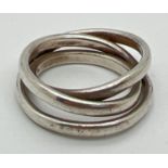 A silver modern design triple band ring. With silver marks to inside of band. Size MÂ½.