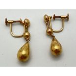 A pair of vintage 9ct gold screw back teardrop drop style earrings. Makers and gold mark to both.