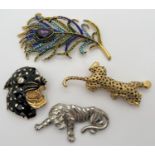 A statement stone set feather brooch together with 3 tiger and leopard brooches. To include a