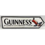 A painted cast iron Guinness wall plaque arrow with toucan detail. Approx. 38cm long.