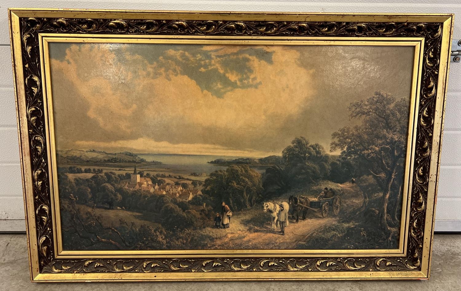 A large gilt framed print of a rural scene. Frame size approx. 76cm x 115cm.