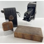 An antique Zeiss Ikon Ikonta 520/2 bellows camera with snakeskin effect leather case. Together