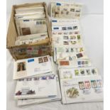 A box of approx 330 assorted vintage first day covers and stamped envelopes.
