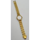 A ladies Citizen Eco-Drive wristwatch with gold plated stainless steel strap, white ceramic face and