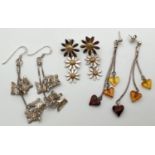 3 pairs of modern design drop style earrings. A pair of graduating size daisy drops by Ylang