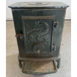 A vintage L. Lange & Co cast iron wood burner, painted green. Approx. 53cm tall x 38.5cm wide.
