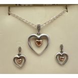 A silver and 9ct gold and diamond set "Love Story" heart shaped pendant necklace and matching