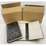 2 boxes containing 7 black faux leather postcard/photograph albums, each holds 50 cards. All