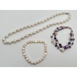 3 items of freshwater pearl jewellery. A elasticated pearl bracelet; an 18 inch pearl necklace