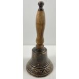 A wooden handled cast metal hand bell, approx. 28cm tall.