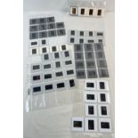 A collection of 65 assorted adult erotic glamour model professional photographic transparencies.
