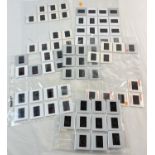A collection of 73 assorted adult erotic glamour model professional photographic transparencies.
