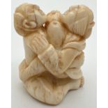 A carved Chinese erotic netsuke with signature mark to underside. Approx. 4.5cm tall.