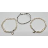 2 matching freshwater pearl and silver bracelets with heart charms, together with a plaited design