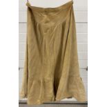 A vintage A-Line style light tan suede skirt by Wallace Sacks. With drop waist and frilled bottom.