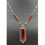 A vintage Art Deco style silver drop pendant necklace set with carnelian and marcasite's. Silver