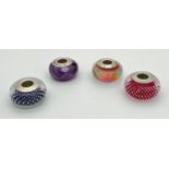 4 silver and glass charm beads by Chamilia. A red small bubble bead, a blue small bubble bead, a