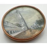 An antique miniature oil painting in a 9ct gold oval brooch. Painting depicts soldiers walking